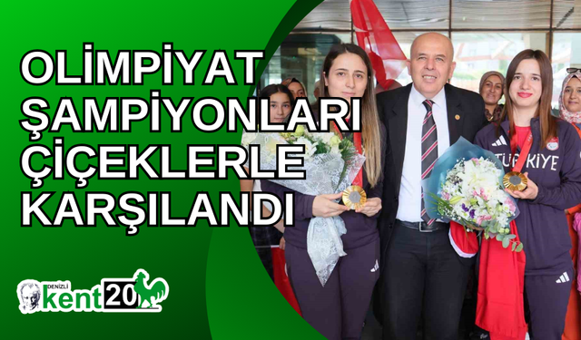 Olimpiyat şampiyonları çiçeklerle karşılandı