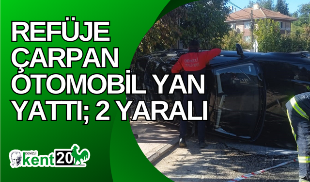 Refüje çarpan otomobil yan yattı; 2 yaralı